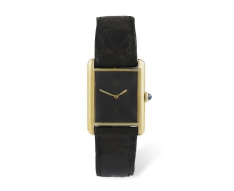 A GOLD PLATED MANUAL WIND 'MUST DE CARTIER' WRISTWATCH, BY CARTIER, the rectangular black dial signed, with gilt hands, polis