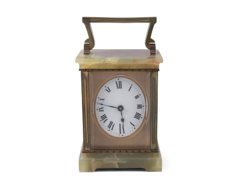 A FRENCH ONYX AND GILTMETAL TRAVELLING CARRIAGE CLOCK, of rectangular form with swing handle, white oval dial with Roman nume