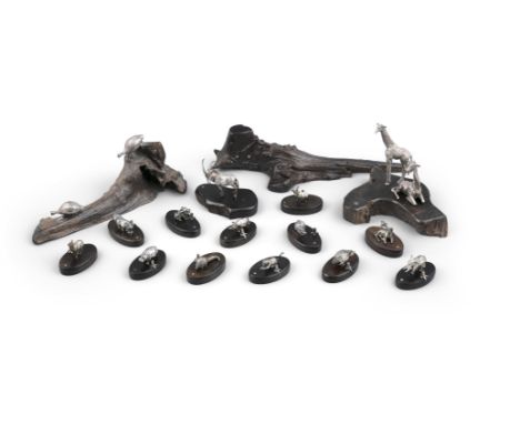 PATRICK MAVROS (ZIMBABWE) A set of twelve cast silver and hardwood place name holders in the form of African wild animals. 3c