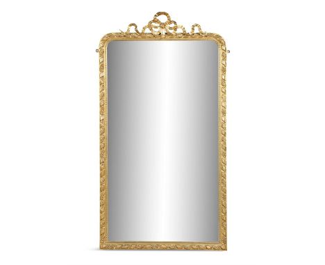 A GILTWOOD OVERMANTLE MIRROR, of upright shaped rectangular form, the mirror enclosed within a beaded, floral and ribbon twis