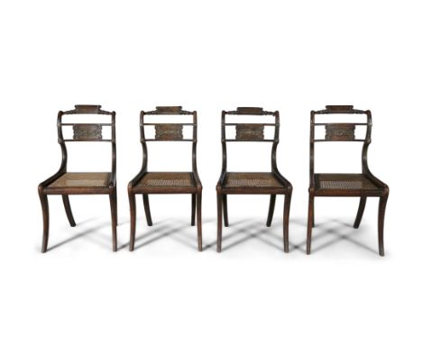 A SET OF FOUR REGENCY 'SCUMBLED' ROSEWOOD DINING CHAIRS, each with turned top rail above a brass mounted panel back, canework