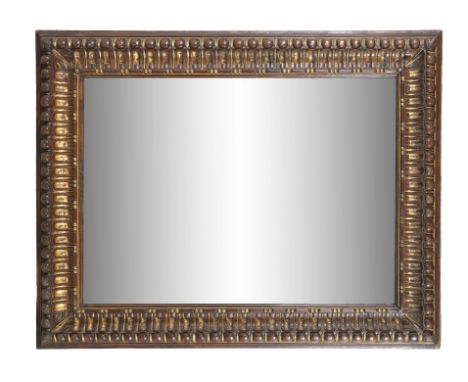 A CONTINENTAL CARVED STAINED AND PARCEL GILT DECORATED WALL MIRROR, with bevelled plate. 75 x 93.5cm