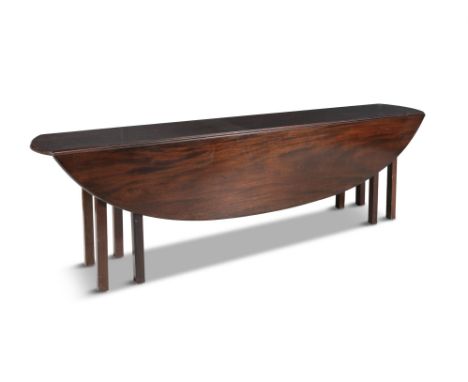 A GEORGIAN STYLE DARK STAINED MAHOGANY HUNT TABLE, with double drop leaves and raised on square gate leg supports. 240cm long