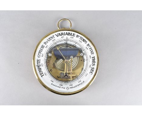 A Hermes wall barometer, of circular form with leather surround to gilt metal body, arabic numerals, French descriptions for 