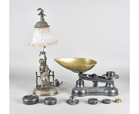 A contemporary bronzed table lamp,  with figural mount of young girl holding pussy cat on oval plinth base with relief roses 