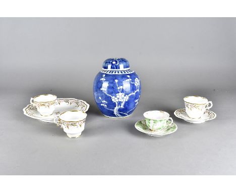 A Meissen cup and saucer, with relief moulded polychrome leaf and vine decoration, each marked to the base, a six setting Sta