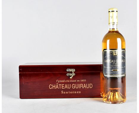 A 1998 Chateau Guiraud 1er Cru Sauternes whiskey set, the bottle in original box, having drinking implements, comprising cork