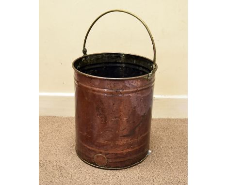 An early to mid-20th century copper tea urn, converted for use as a stick stand, with brass loop handle 46 cm H 