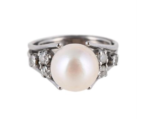 
	
		A CULTURED PEARL AND DIAMOND DRESS RING  
		The cultured pearl between trios of old cut diamonds, approximately 0.36 car