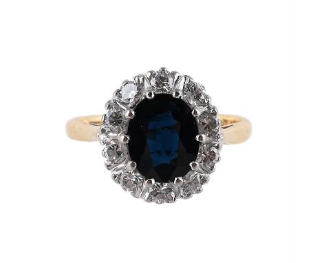 
	
		BRAVINGTONS, A SAPPHIRE AND DIAMOND CLUSTER RING 
		The oval cut sapphire within a brilliant cut diamond surround, in an