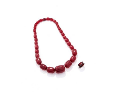 
	
		A CHERRY COLOURED RESIN BEAD NECKLACE AND SIMILAR RING 
		The graduated resin beads to a screw clasp, the beads measurin