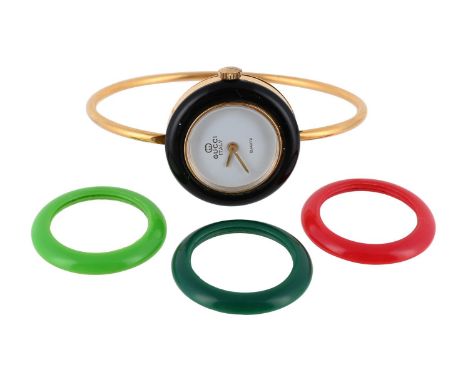 
	
		GUCCI, A LADY&#39;S BRACELET WATCH WITH INTERCHANGEABLE BEZELS 
		With signed white dial, quartz movement, gold plated c