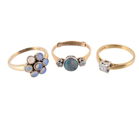 
	
		THREE OPAL AND DIAMOND RINGS
		The first an opal and diamond three stone ring, the circular cabochon opal between old cu