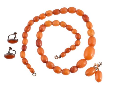 
	
		AN AMBER BEAD NECKLACE AND TWO PAIRS OF EARRINGS 
		The graduated oval amber beads to an associated ring bolt clasp; tog