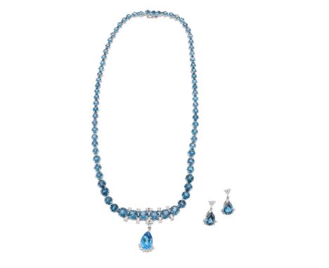
	
		A BLUE TOPAZ AND DIAMOND NECKLACE AND EARRING SUITE  
		LONDON 1989 
		The necklace with graduated circular cut blue top