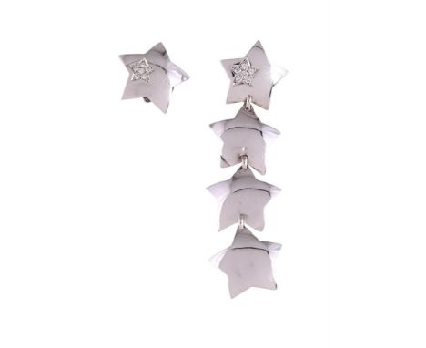 
	
		A PAIR OF DIAMOND EARRINGS 
		The domed star shaped pediments with diamond accents and stud fittings, one earring suspen