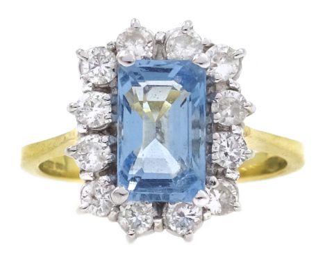 18ct gold emerald cut aquamarine and round brilliant cut diamond cluster ring, hallmarked 18ct Condition Report Approx 4.8gm,