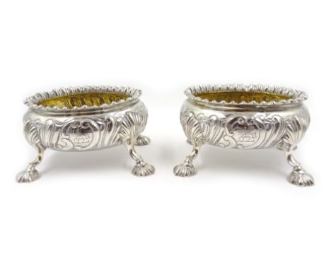 Pair of early Victorian silver salts, gadrooned borders, embossed scroll decoration, gilt interiors, contemporary crests by W