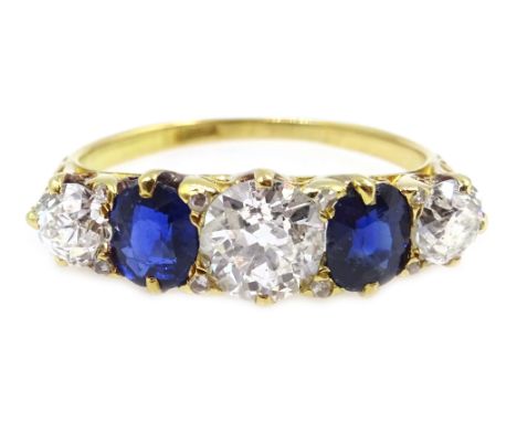 Gold five stone diamond and sapphire ring, stamped 18ct, central diamond approx 0.8 carat Condition Report Approx 3.9gm, size