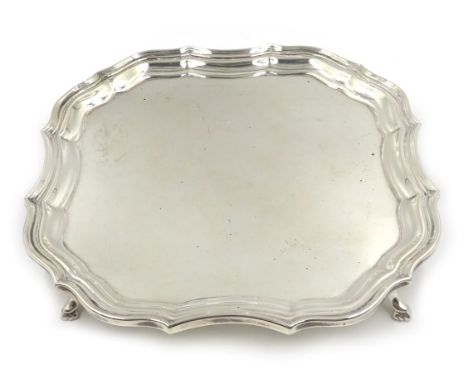 Silver waiter moulded border on four hoof feet by Barker Brothers Silver Ltd, Birmingham 1927, 18cm approx 8.5oz Condition Re