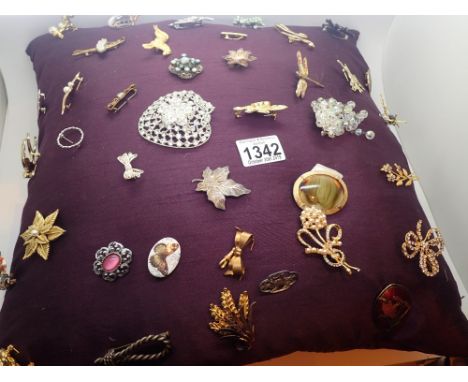 Cushion of brooches largest 7.5 cm