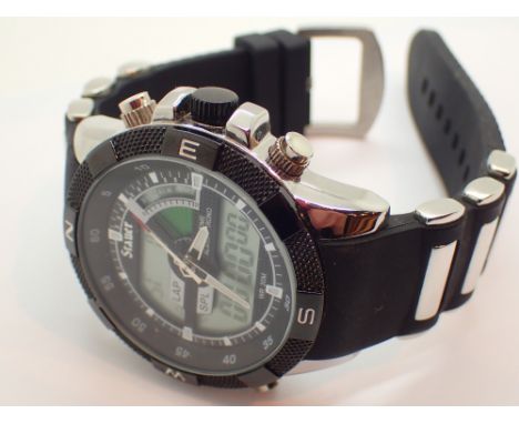 Boxed Stauer digital wristwatch with steel case and rubber strap backlit dial displays anologue chapters and has a subsidairy