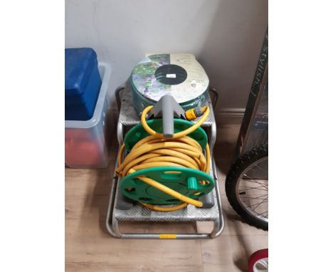 METAL 2 STEP PLATFORM STAND TOGETHER WITH HOSE ON REEL WITH SPARE HOSE PIPE