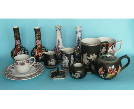 A pair of black ground vases with coloured enamel decoration in the Oriental taste, 172mm, another similar pair, six black gr