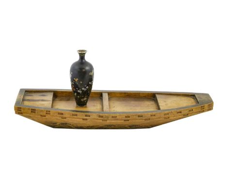 A Japanese Two-Colour Gold Inlaid Hardwood Model of a Boat, Meiji period, with waves running along the side, 41cm long; and A