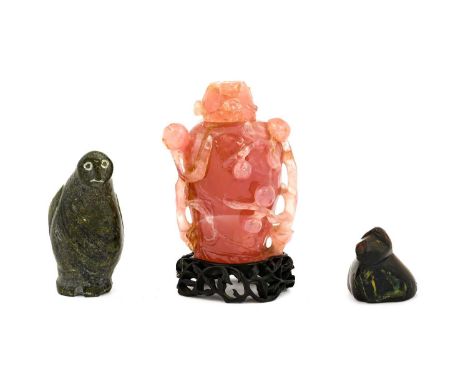 A Chinese Rose Quartz Jar and Cover, 19th century, of flattened baluster form, carved in relief and pierced with peaches, 14c