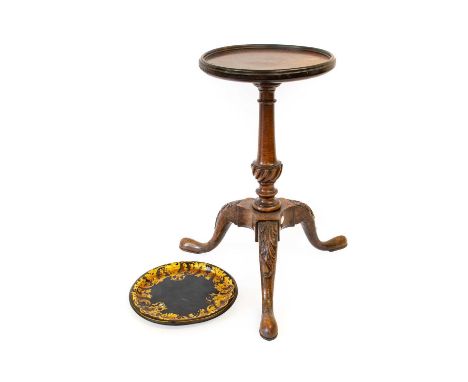 A Mahogany Wine Table, in George II style, the circular top with reeded border, on baluster stem and tripod base with carved 