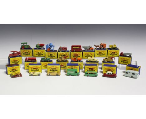 Sixty Matchbox Series Moko Lesney vehicles, including a No. 1 road roller, a No. 11 ERF tanker, finished in red with gold tri