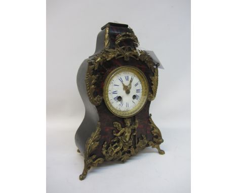 Late 19th century mantle clock, mounted by cherub finial, red tortoiseshell frieze foliate gilt metal brackets and decoration