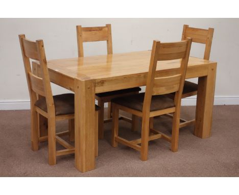 Solid oak rectangular dining table (150cm x 90cm, H76cm), and four ladder back dining chairs with upholstered seats Condition