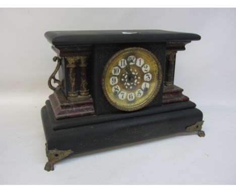 Victorian faux marble mantle clock, the projected rectangular top over gilt metal face, Arabic numerals, flanked by columns a