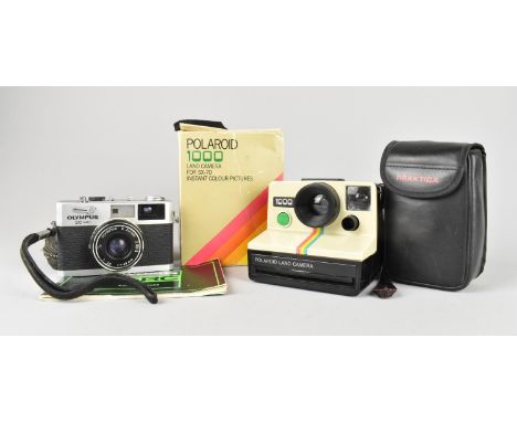 A Collection of Vintage Cameras to include Polaroid 1000, Olympus 35RC and Praktica AP310