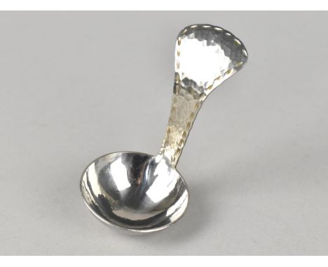 A Keswick School of Industrial Art Hammered Tea Caddy Spoon inscribed 'Firth Staybrite'