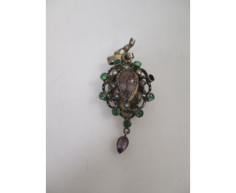 A 19th century enamel and gemset pendant locket, the central pale mauve pear shaped hardstone surrounded by seed pearls and a