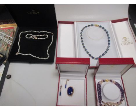 A blue hardstone and pearl bead necklace with clasp stamped 750, an amethyst and pearl multi-strand bead bracelet with clasp 