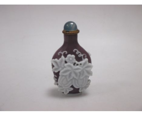 A jade and a white overlaid purple snuff bottle  