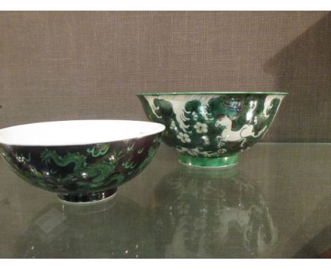 A Kangxi and a Qianlong marked bowl, the first painted with horses (2)  Aged rubbing to interior of clear bowl, other bowl go
