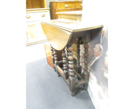 EG. A 17th century and later walnut/ mahogany table on bobbin turned gate legs,  