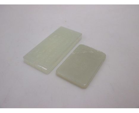 Two Chinese jade rectangular pendants, one caved with a warrior on horseback and the other with two birds flying over reeds  