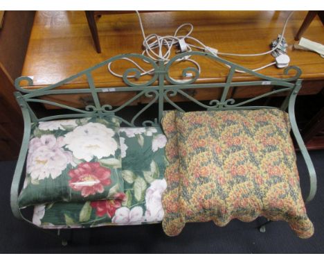 A green painted iron strap work garden bench  