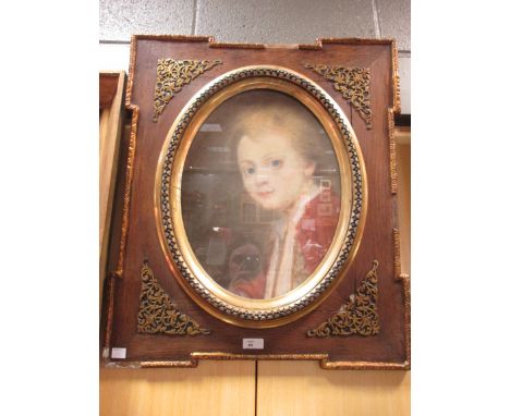 French School, late 19th century, a portrait of a boy, pastels in an oak frame, oval, 39 x 29cm  