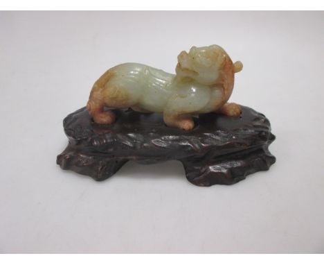 A Chinese jade qilin on wooden stand  No damage