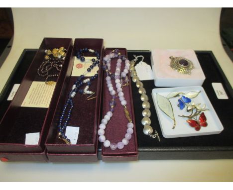 A group of Scandanavian silver jewellery to include enamelled Norweigan brooches, an ivy leaf bracelet, a Finnish amethyst pe