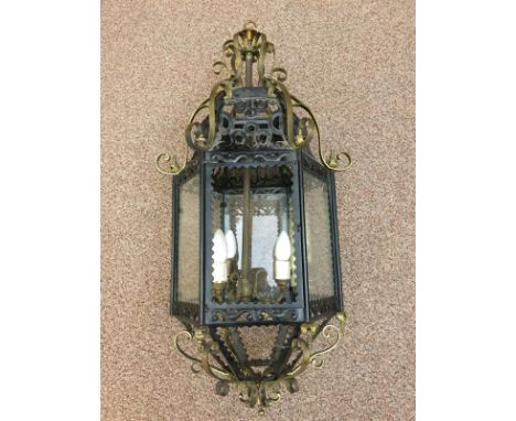 A brass mounted and black painted tin plate hall lantern, with cast and turned finials 82cm (32in)  