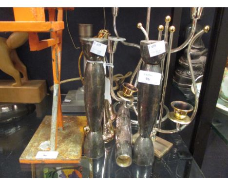 A collection of modernist candlesticks and a pair of jugs, together with an Art Deco lamp  