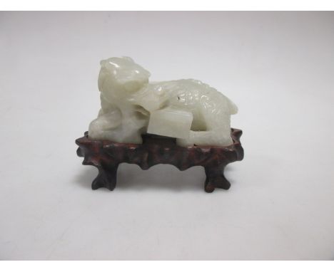 A 'Mutton fat jade' type dragon guarding a box, on wooden stand  No damage